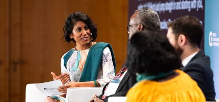 Janani Vivekananda (Head of Programme Climate Diplomacy and Security, adelphi) introducing the second panel of the conference Shot of the second panel, Janani Vivekananda speaking to the panel guests