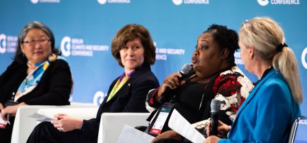 From left to right, Hiroko Hirahara (Director of Civil Affairs Division, United Nations Mission in South Sudan, UNMISS), Anne Witkowsky (Assistant Secretary, Bureau of Conflict and Stabilization Operations of the United States Department of State), and Gerty Pierre (Climate Change Director, Ministry of Environment of Haiti) Female Speaker speaking into mic at BCSC2024
