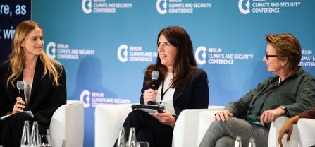 Emma Whitaker (adelphi), Elizabeth Carabine (UN Office of the Special Envoy of the Secretary-General for the Horn of Africa) and Almut Wieland-Karimi (Member of the Advisory Board of the UN Peacebuilding Fund & Stiftung Mercator & Weathering Risk) Female speaker speaking in he mic on panel of BCSC2024