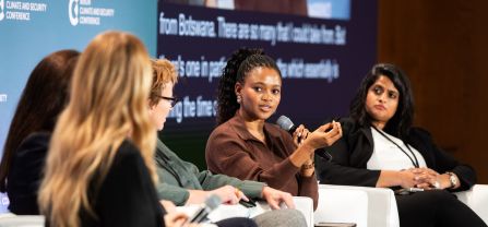 From left to right, Hon. Bogolo Joy Kenewendo (Managing Director, Kenewendo Advisory) holding the microphone and Swathi Veeravalli (National Security Council, USA) Female speaker speaking in he mic on panel of BCSC2024